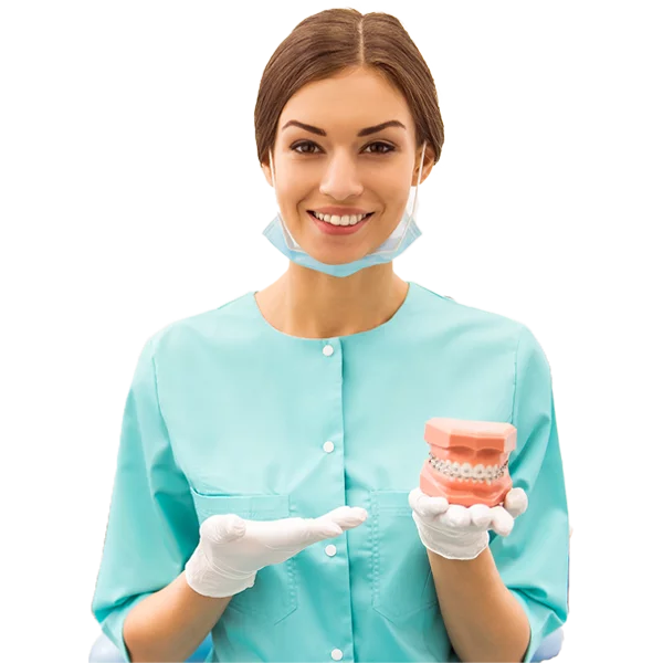 Home 3 Dental team member holding a model of teeth